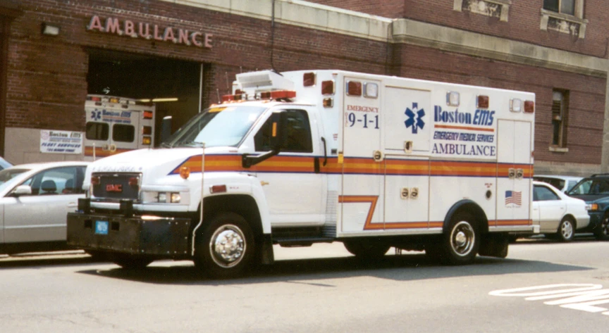 an ambulance is parked in front of an ambulance station