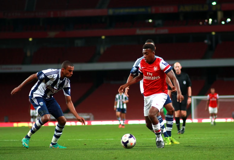 the two men are playing soccer on the field