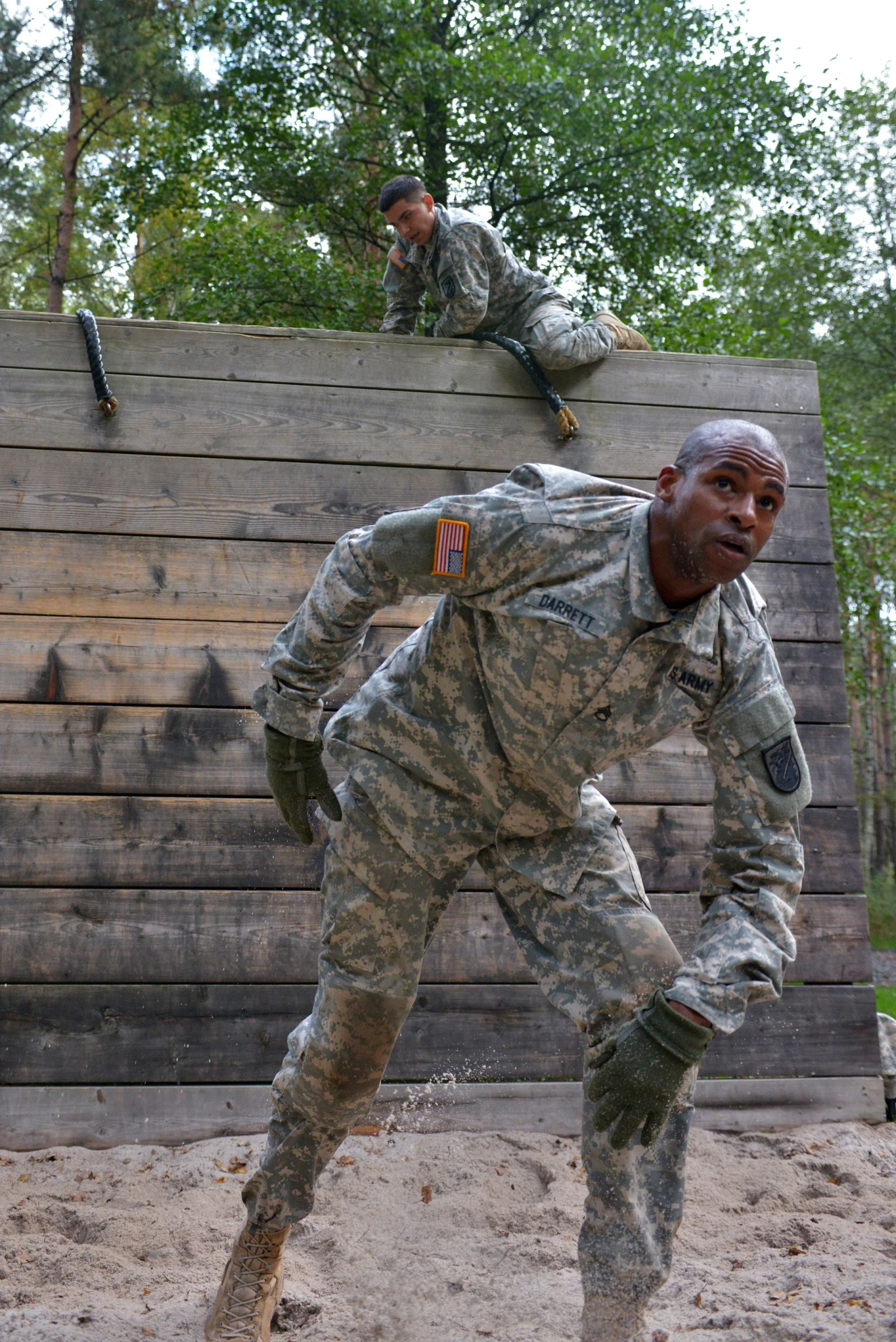 a soldier with his leg up doing a trick