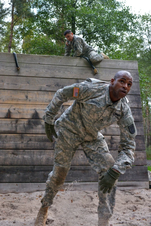 a soldier with his leg up doing a trick