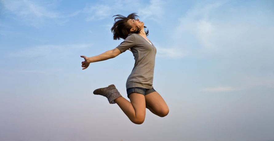 an image of woman that is jumping in the air