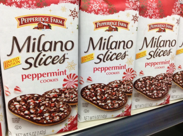 there are three packages of peppermint cookies on the shelf