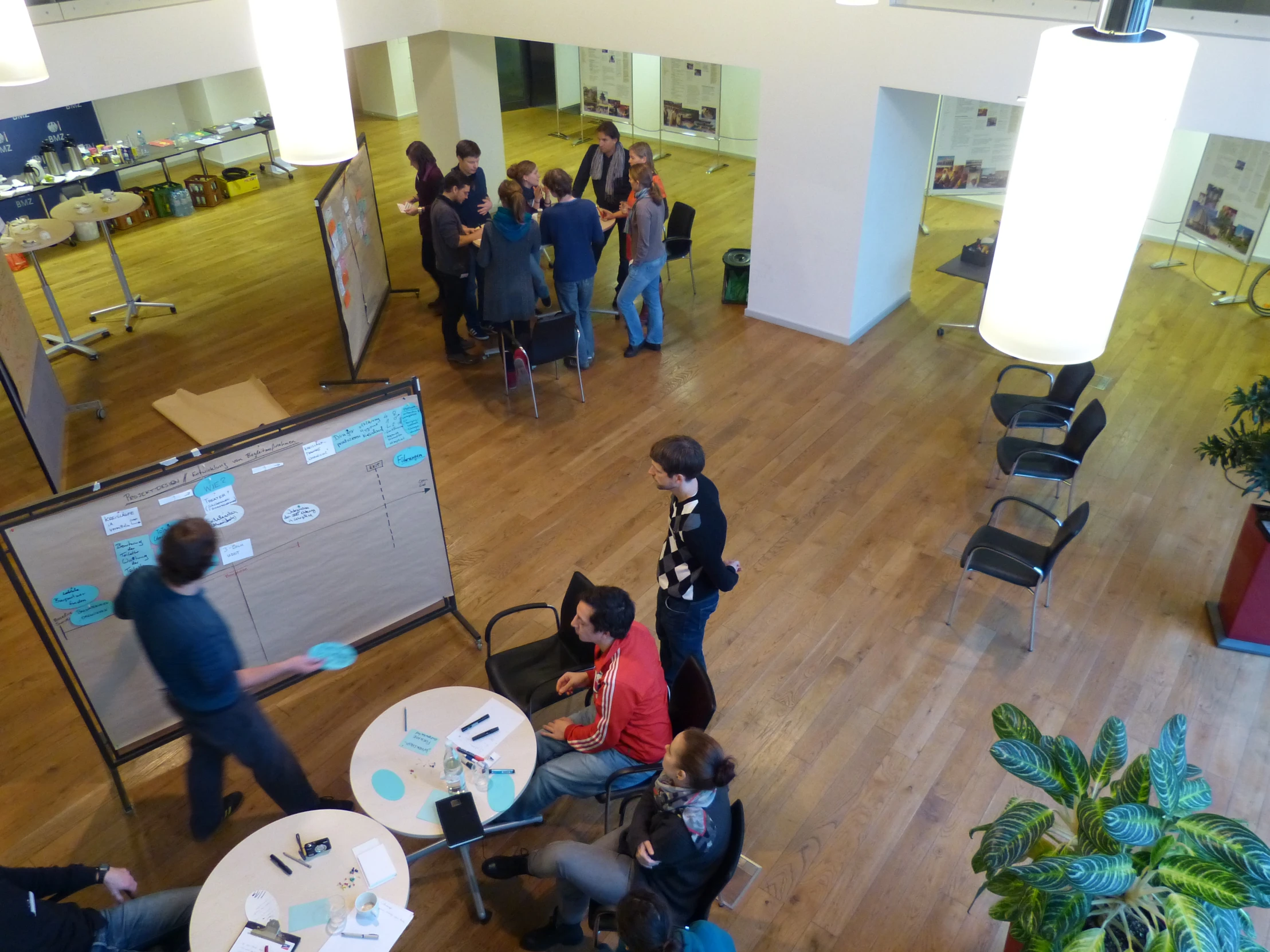 a group of people in an office area having a meeting