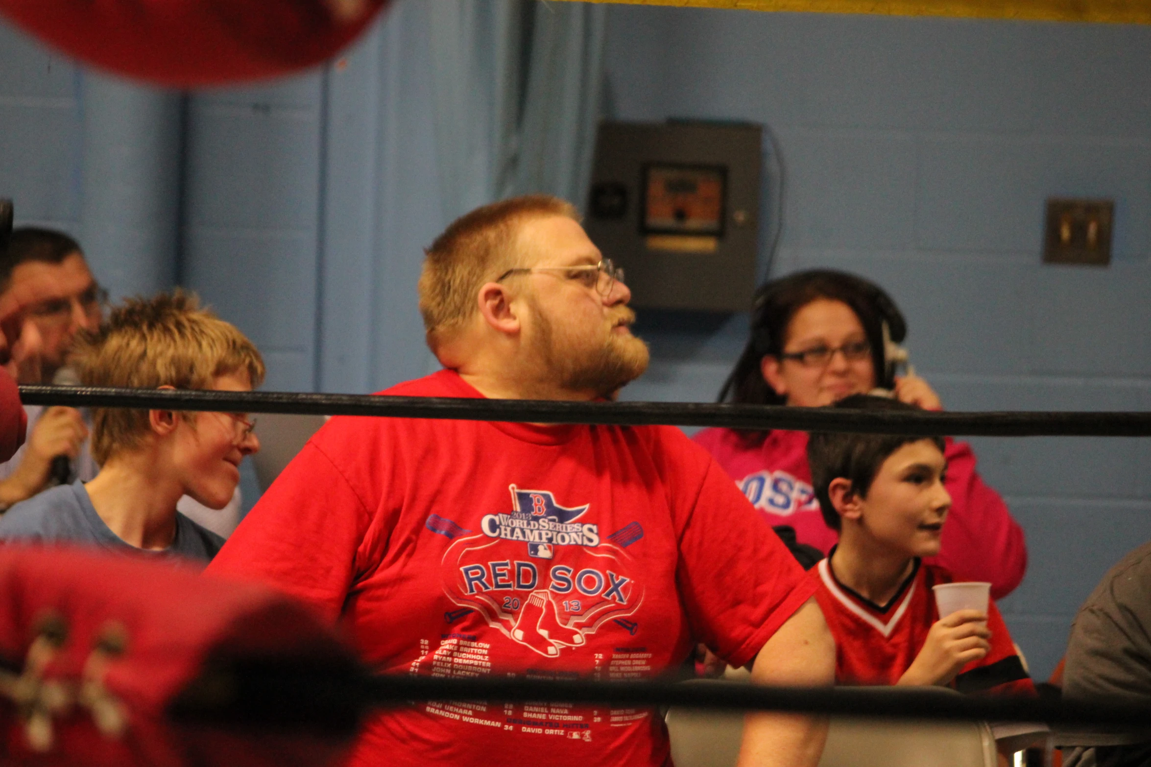 a group of people in an arena watching soing