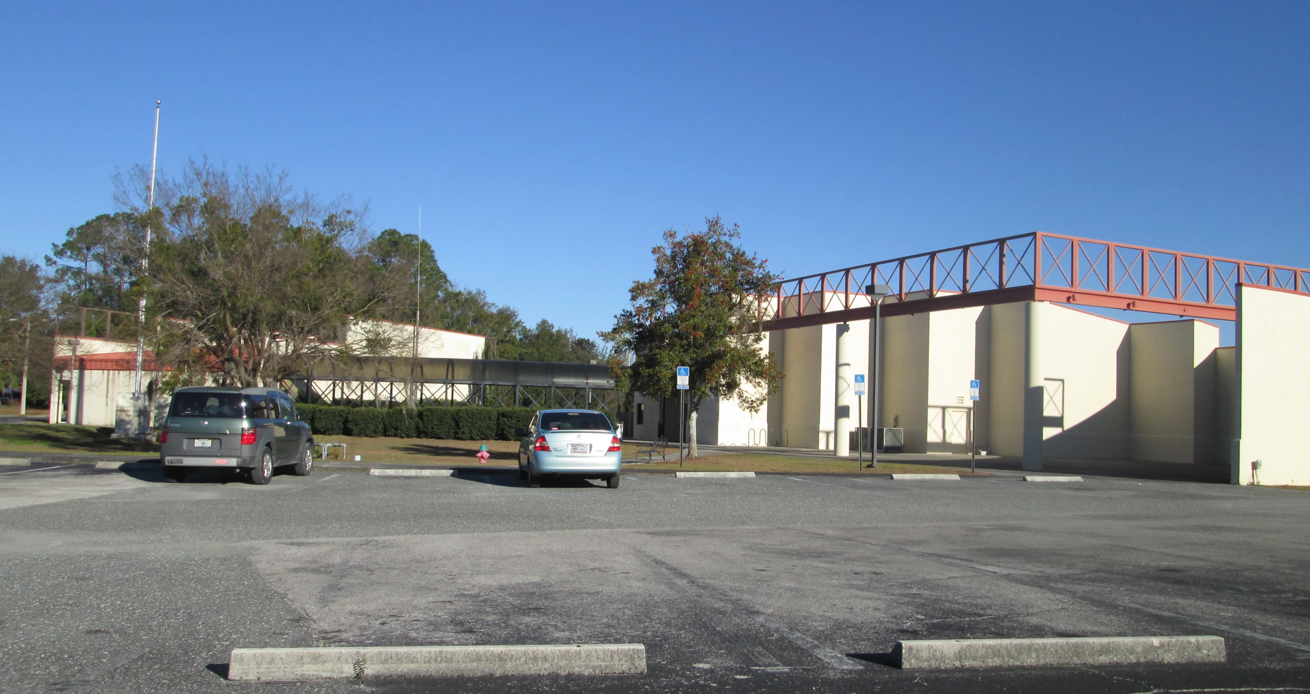 a couple of vehicles are in a parking lot