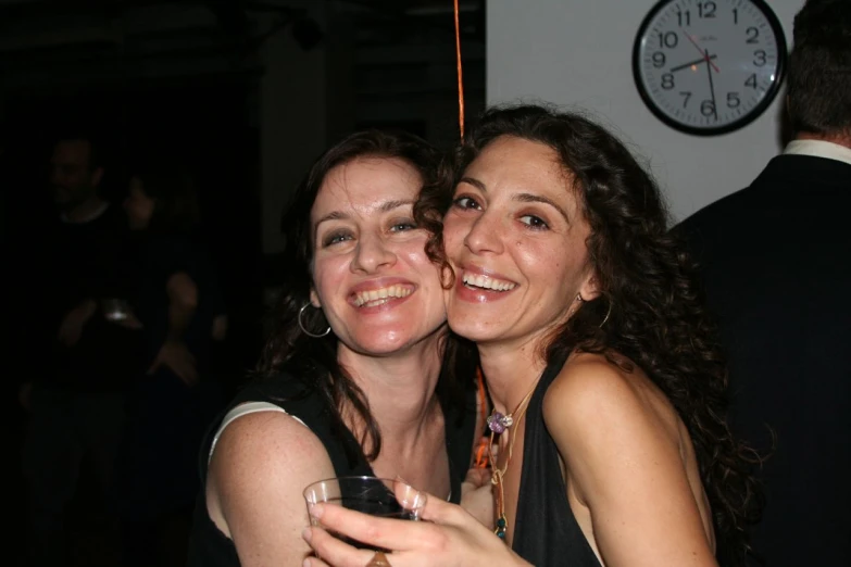 two women are taking a selfie while smiling