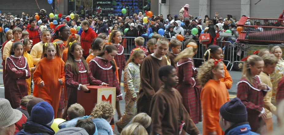 a parade that is lined up on the street