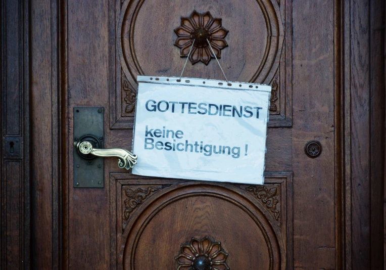 this is an image of a sign on a wooden door
