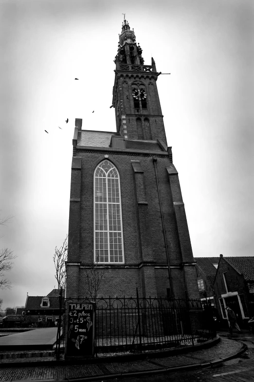 a tall tower has a clock on it