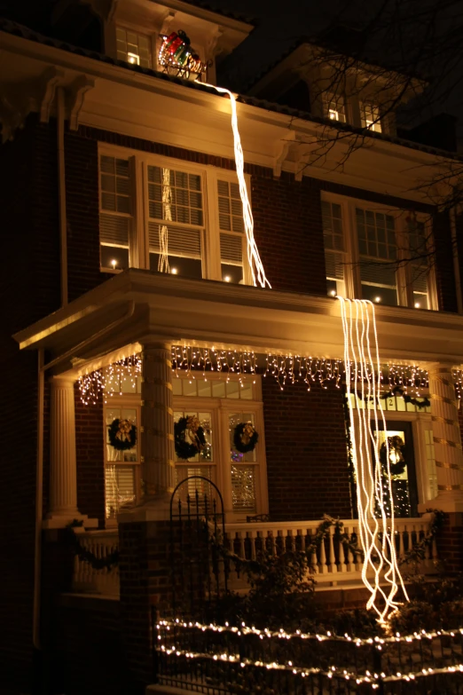 a large house that is decorated with holiday lights