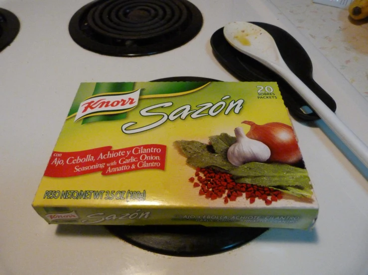 a small box of cooking sauce sits on the stove