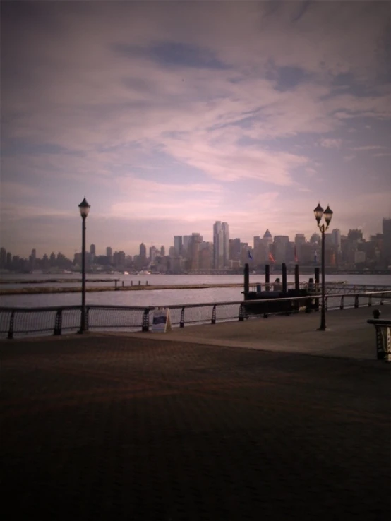 some street lamps on the edge of the river