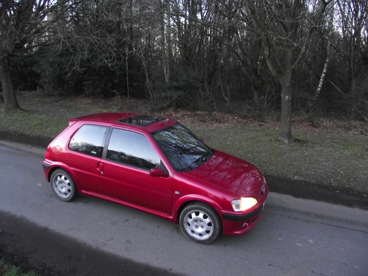 a red car parked on the side of the road