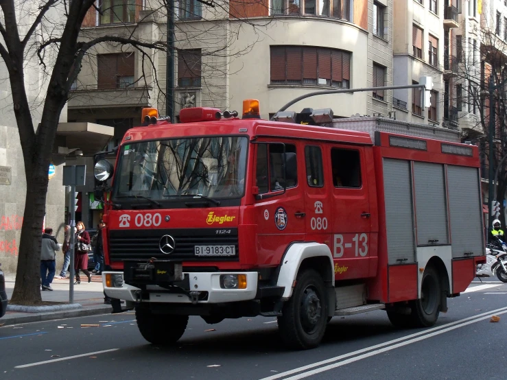 there is a large red firetruck on the street