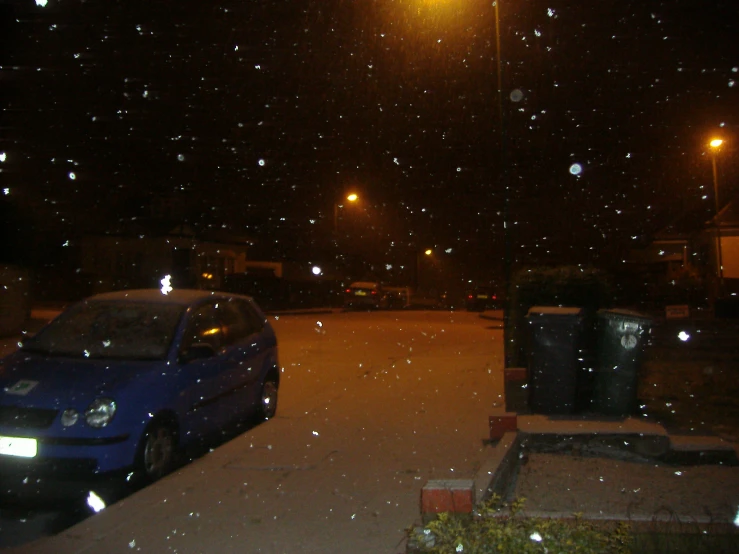 cars parked on the side of the road covered in snow