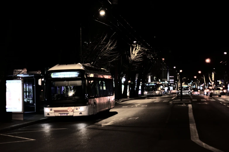 this is a city bus making it's way down the road