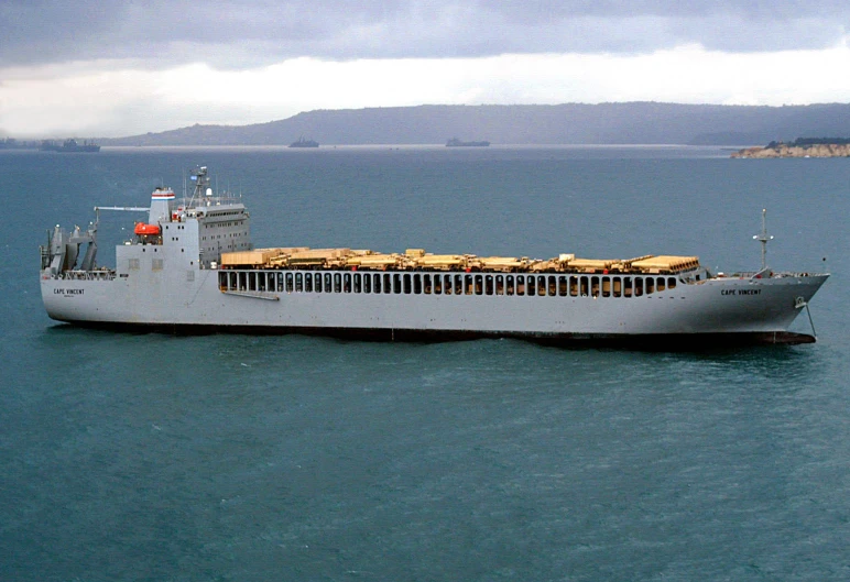 a large ship sails in the open ocean