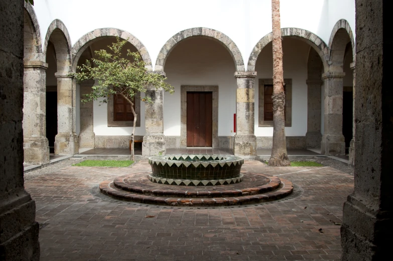 there is an indoor courtyard with multiple arches