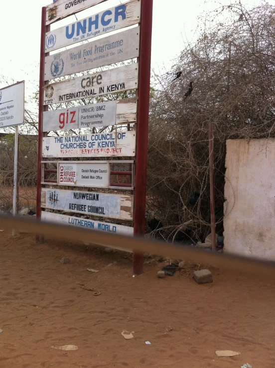 a large sign by the side of the road