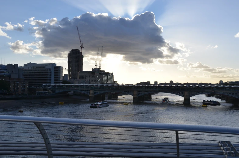 the sun shines down on a skyline and river