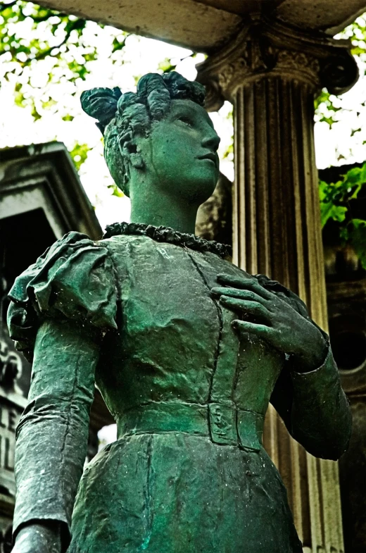 a statue of a woman is outside on display