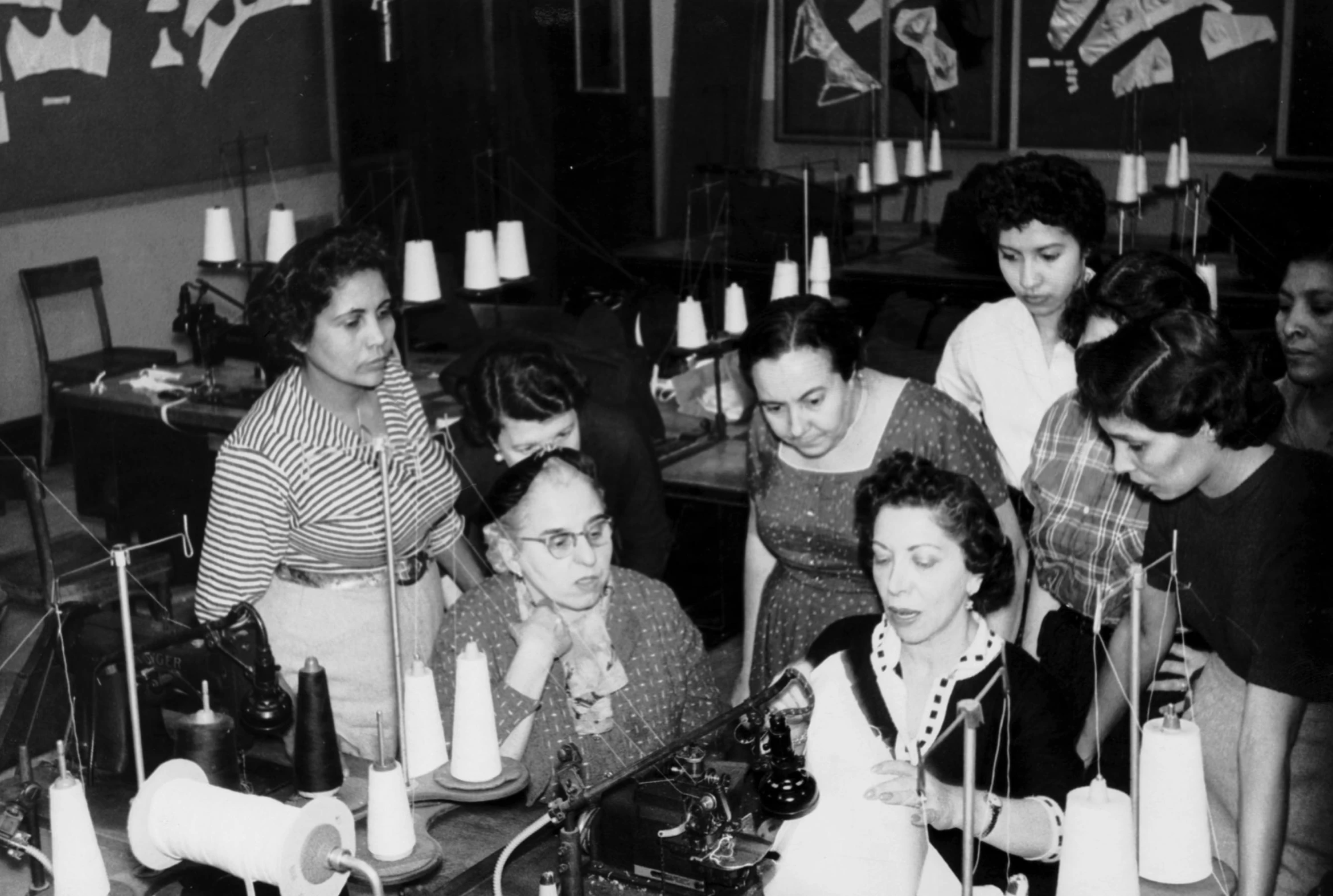 vintage po of woman at table with machine