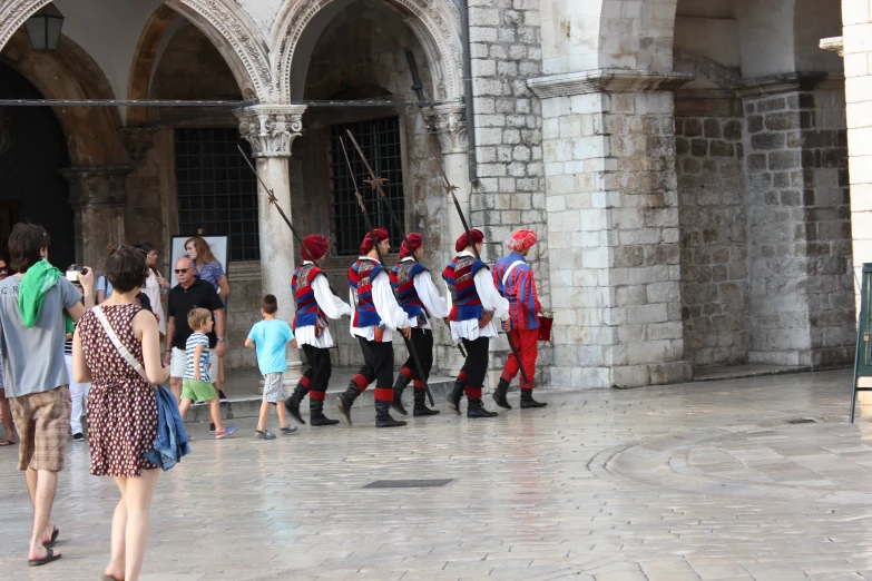 a group of people in costume are walking together