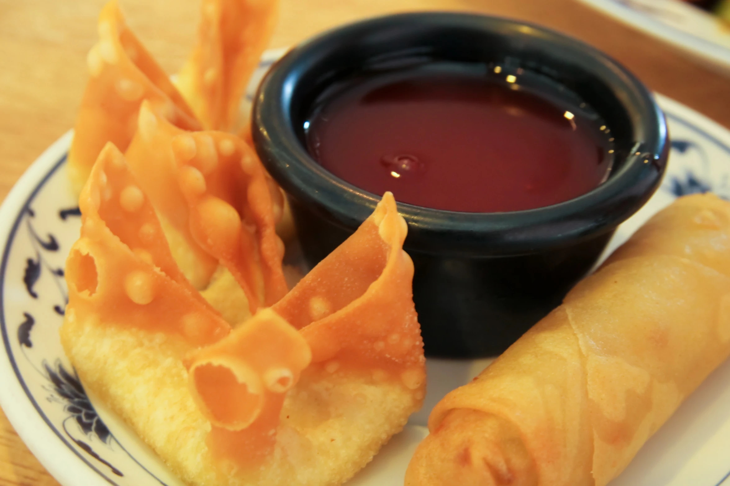 several foods sitting on a plate with sauce