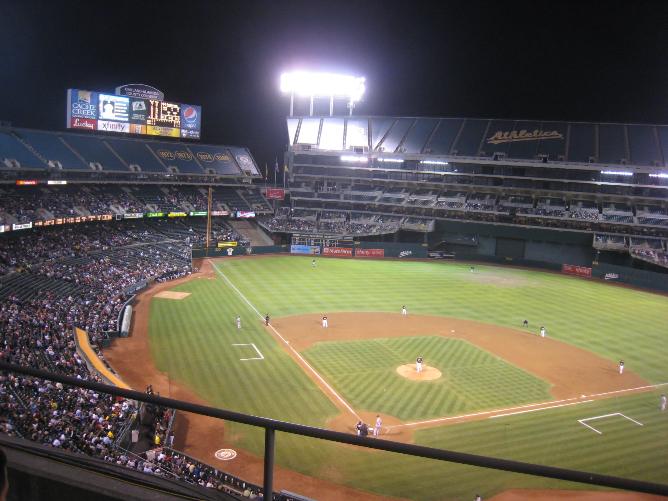 a baseball game in a stadium at night