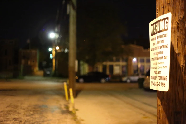 an image of a street sign hanging from a pole