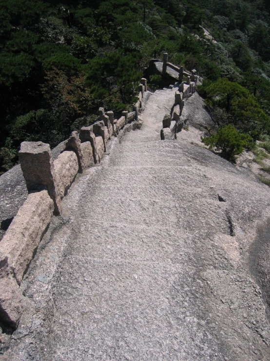 a cement path with benches along the sides of it