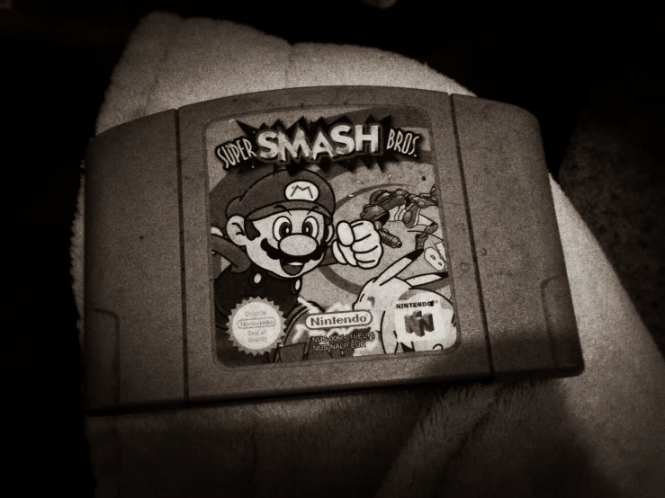 a black and white image of a nintendo gaming console
