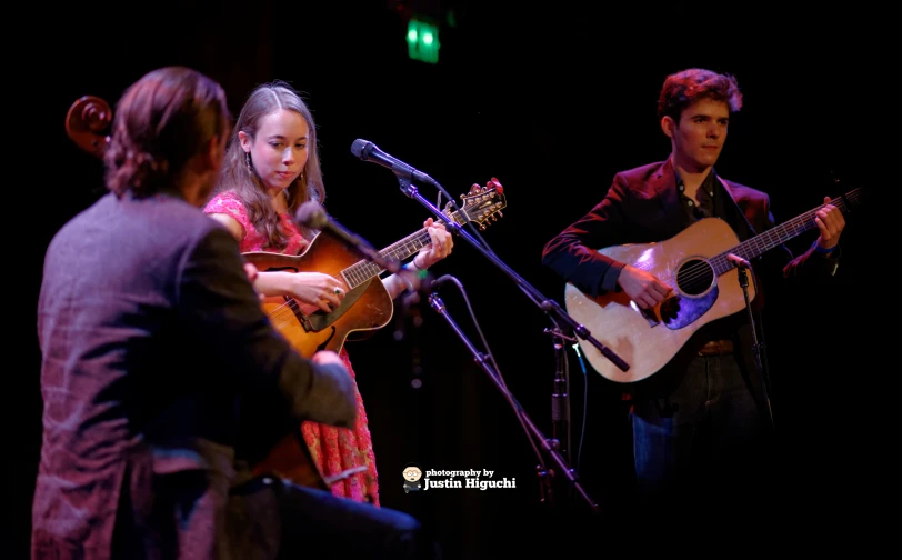 two people playing instruments at a concert