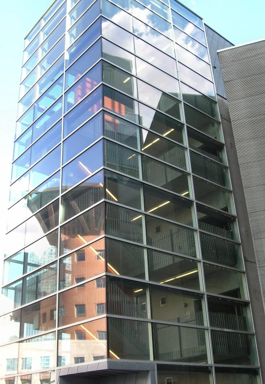 some glass balconies on the side of a tall building