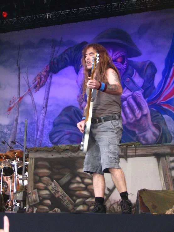 a man standing in front of a colorful background on stage