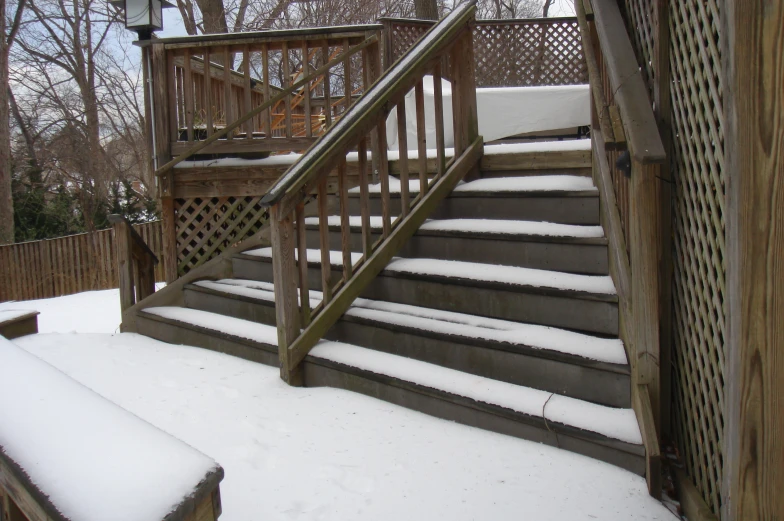 a porch covered in snow and covered in snow