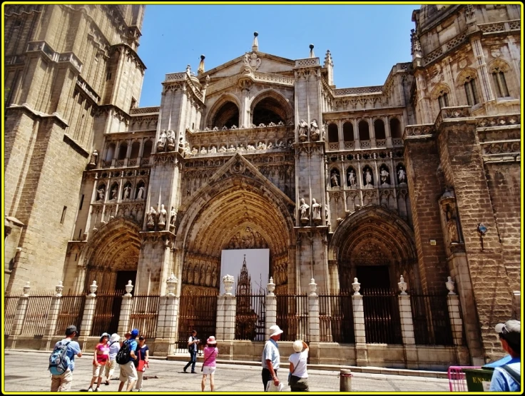 several people walking near large and ornate building