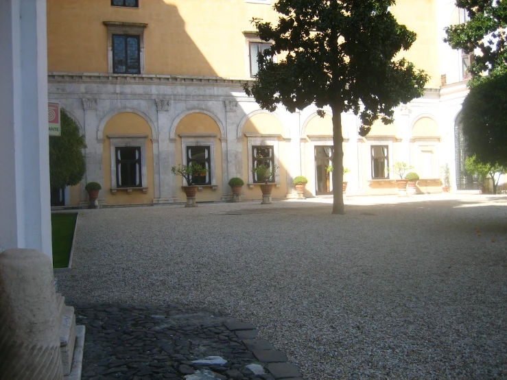 an old building is empty and empty with trees in front