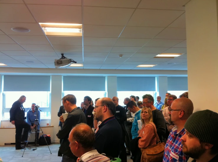 a group of people standing in a room