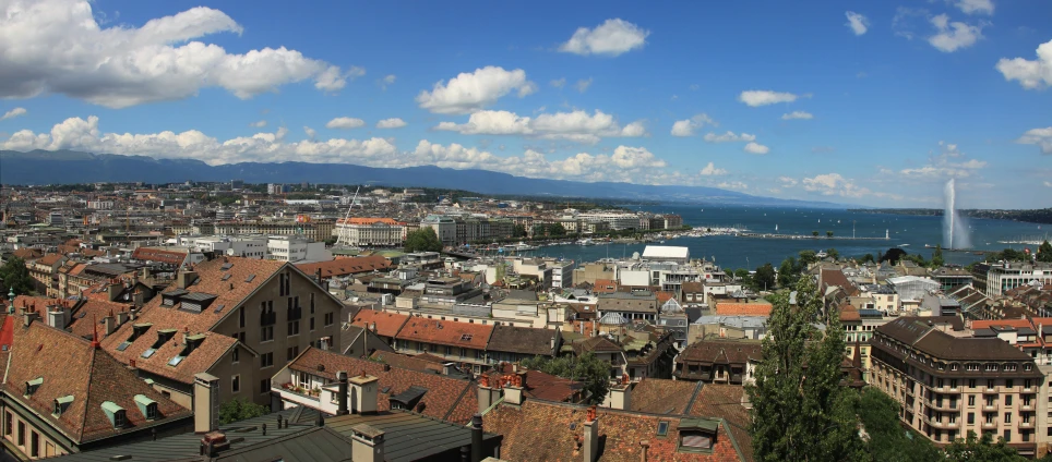 the view from the rooftops overlooking the city with boats on the water