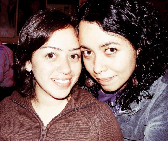 two women taking a selfie while wearing jackets