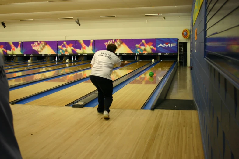 a person playing with a bowling ball