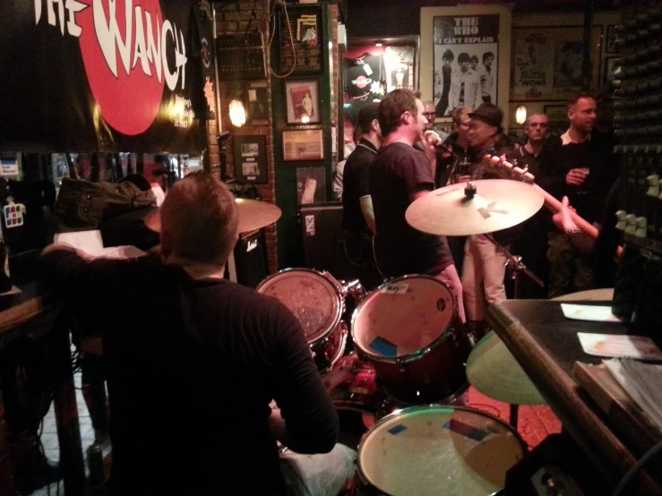 people playing a game inside a small bar