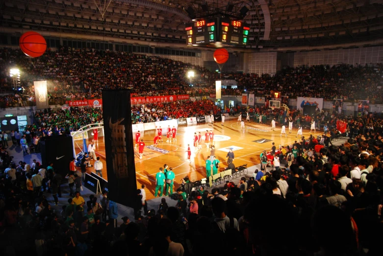 a basketball game being played inside an arena