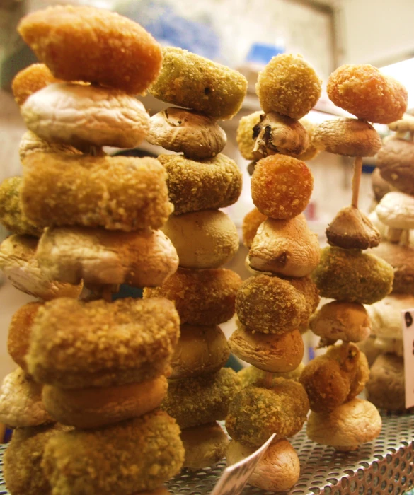 an assortment of donuts arranged on display at a shop