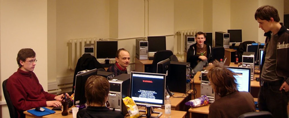 a group of people are using a computer together