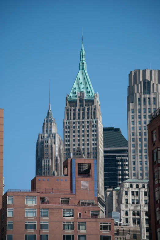 an urban area with skyscrs and a clock tower