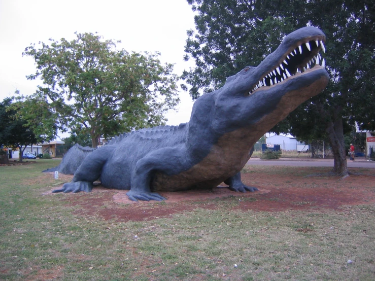 a statue of a dinosaur is shown outside