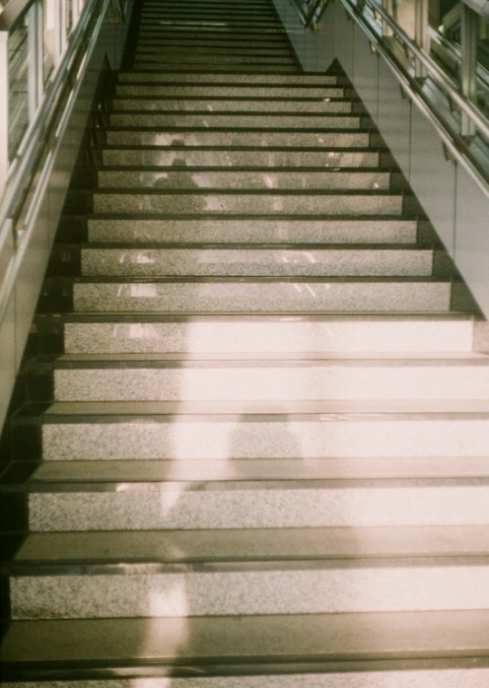 shadow on steps under some stairs in a building