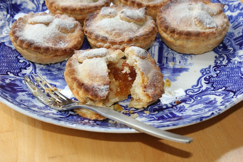 several pastries are shown on a plate with a fork